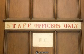 Signage on one of the doors inside the house.